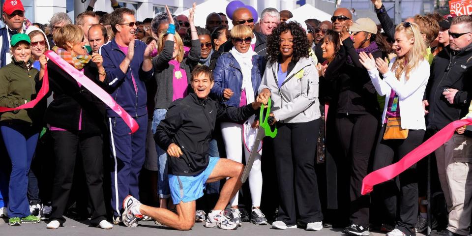 Media personality and physician Dr. Mehmet Oz (left center) and media personality Oprah Winfrey (right center) cut the ribbon to signal the start of the 