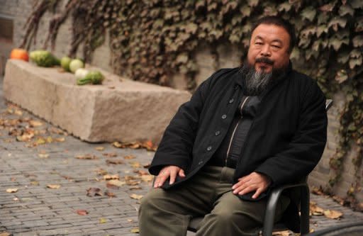 Chinese artist Ai Weiwei sits in the courtyard of his home in Beijing where he remains under house arrest in a file photo from 2010. US museums are facing delicate choices as they strive to meet a growing interest in China, cooperating with counterparts across the Pacific despite alarm over the detention of top artist Ai Weiwei