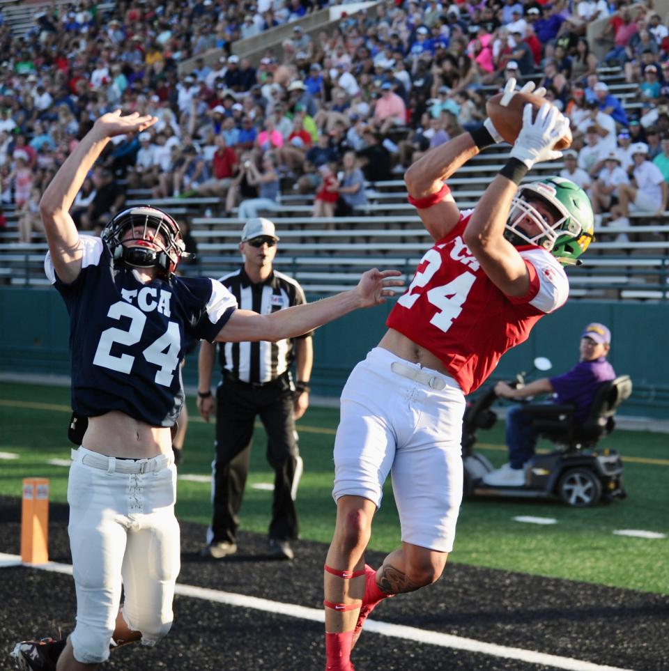 Eldorado's Korbin Covarrubaiz catches a touchdown pass from Wylie's Aden Kincaid at the Big Country FCA All-Star Game on Saturday.