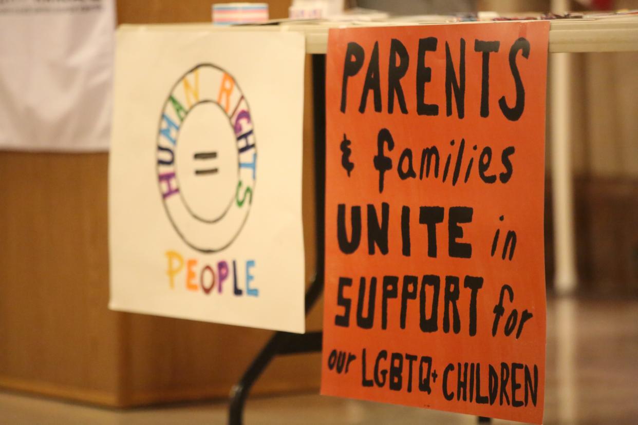 Signs in support of transgender Kansans are seen at a rally Tuesday hosted by Equality Kansas at the Statehouse. It comes as lawmakers considered a number of bills opponents have criticized as anti-LGBT.