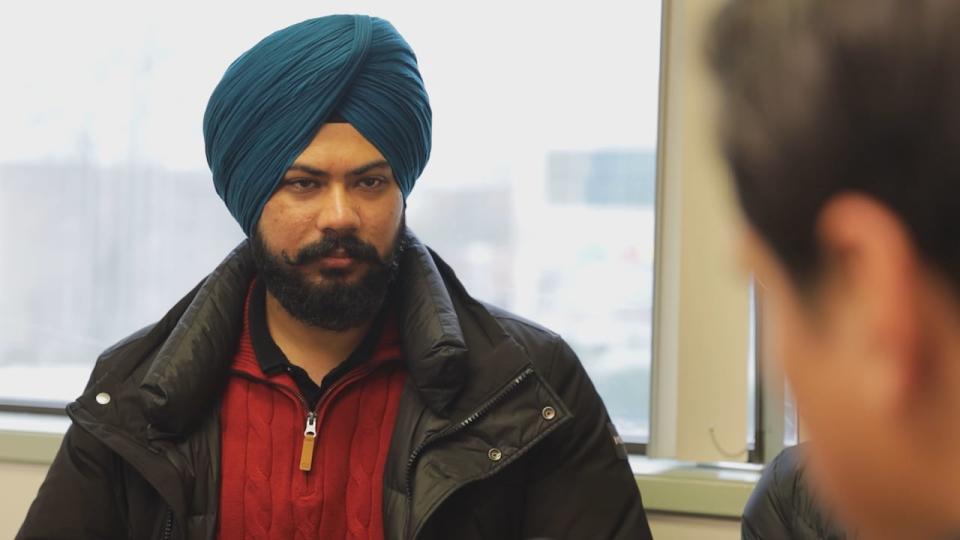 Jashan Sidhu is pictured inside the International Student Union office at PICS Society in Surrey, B.C.