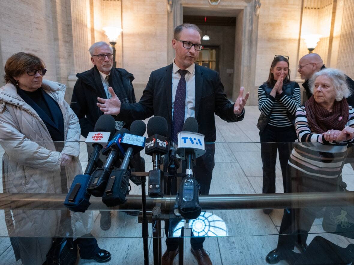 Pro-Bill 21 lawyer Guillaume Rousseau, right, comments on the Quebec Court of Appeal ruling in support of Bill 21, Quebec's religious symbols law, in Montreal, Thursday, Feb. 29, 2024.  (Ryan Remiorz/The Canadian Press - image credit)