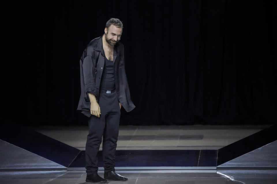 Louis-Gabriel Nouchi accepts applause after his fall-winter 22/23 men's collection, in Paris, Saturday, Jan. 22, 2022. (AP Photo/Francois Mori)