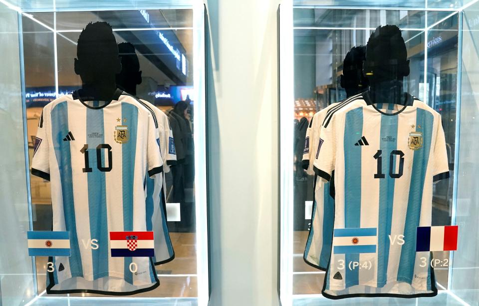 The set of six 2022 World Cup jerseys worn by Messi sold for $7.8 million at auction on Thursday. (Photo by TIMOTHY A. CLARY / AFP)