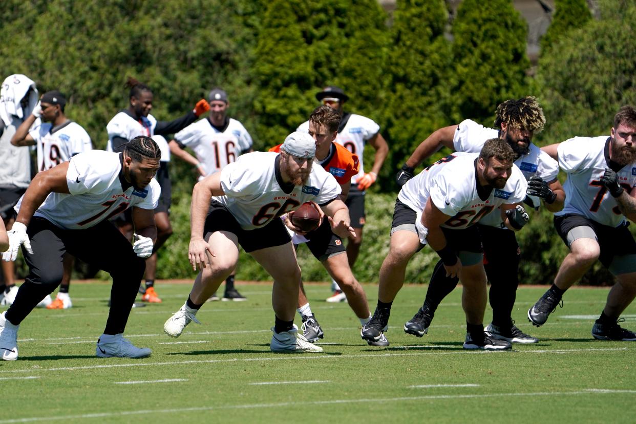 Cincinnati Bengals quarterback Joe Burrow (9) takes a snap during practice, Tuesday, May 17, 2022, at the Paul Brown Stadium practice fields in Cincinnati. 