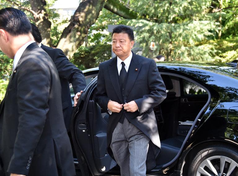 Japanese Internal Affairs Minister Yoshitaka Shindo arrives at the controversial Yasukuni shrine in Tokyo on August 15, 2014, the 69th anniversary of Japan's surrender from World War II