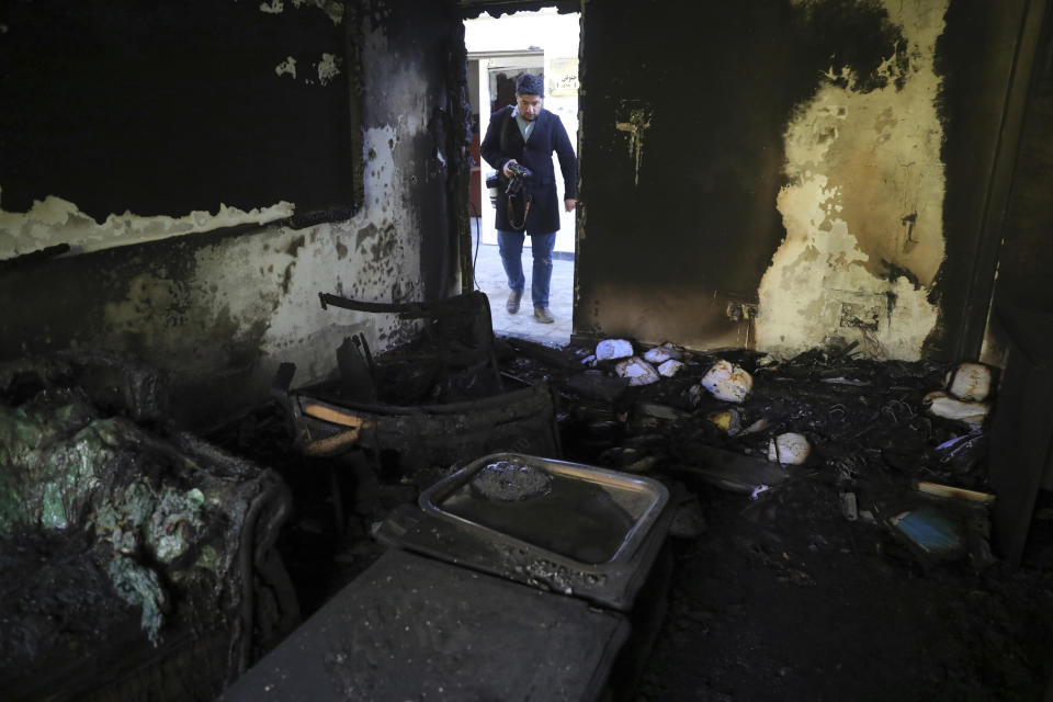A burned office at the Kabul University is seen after a deadly attack in Kabul, Afghanistan, Tuesday, Nov. 3, 2020. The brazen attack by gunmen who stormed the university has left many dead and wounded in the Afghan capital. The assault sparked an hours-long gun battle. (AP Photo/Rahmat Gul)