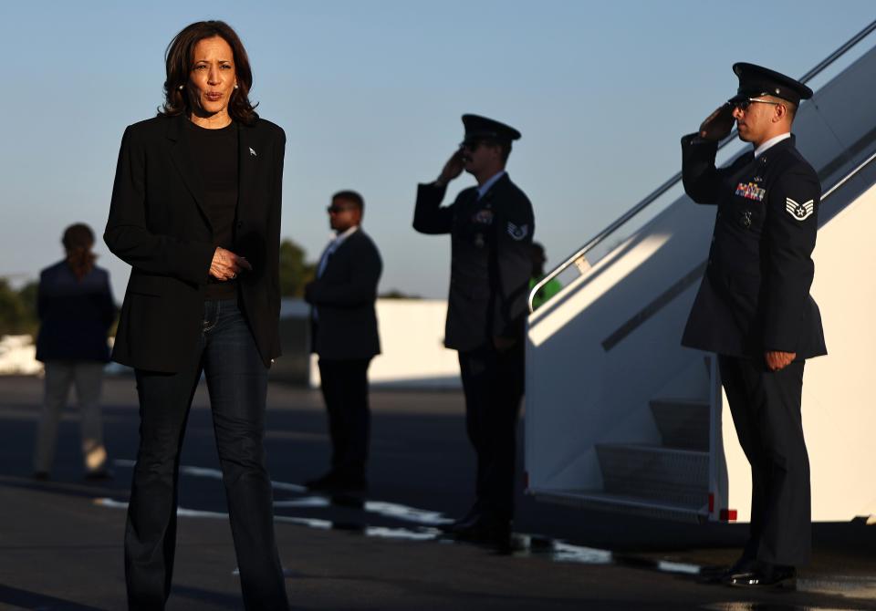 CHARLOTTE, NORTH CAROLINA - OCTOBER 05: Democratic presidential nominee, Vice President Kamala Harris walks to speak to the media before boarding Air Force Two after assessing the Hurricane Helene recovery response in North Carolina on October 5, 2024 in Charlotte, North Carolina. Harris was briefed on recovery operations at the Charlotte Air National Guard Base, visited a donation drop-off site for storm victims and met with impacted families. According to the Vice Presidentâ€™s office, 74 percent of people who lost electricity during the storm now have power restored. (Photo by Mario Tama/Getty Images) ***BESTPIX*** (Getty Images)