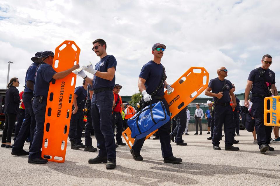 First responders and students from Lorenzo Walker Technical College gather for a debriefing after a simulated disaster exercise at Naples Airport on Tuesday, April 25, 2023.