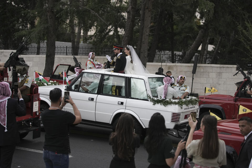 Jordan's Crown Prince Hussein and Saudi Rajwa Alseif leave Zahran Palace during their wedding ceremonies on Thursday, June 1, 2023, in Amman, Jordan. (AP Photo/Nasser Nasser)