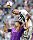 Soccer Football - Serie A - Juventus v Fiorentina - Allianz Stadium, Turin, Italy - April 20, 2019 Fiorentina's Giovanni Simeone in action with Juventus' Alex Sandro REUTERS/Massimo Pinca