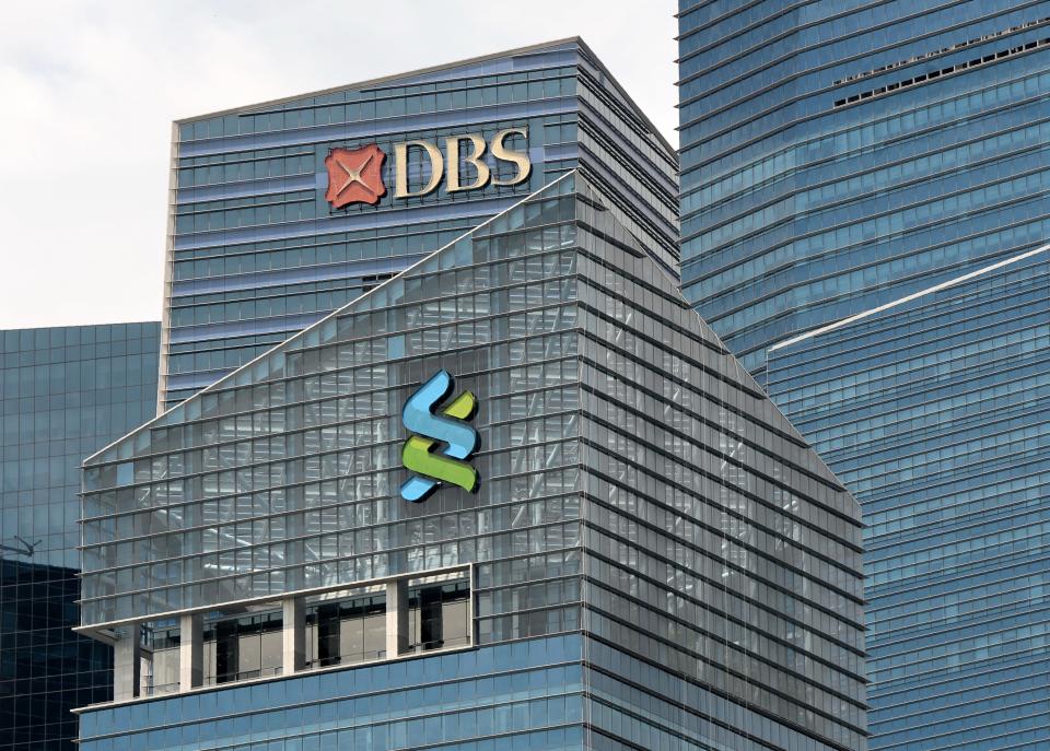 A DBS (top) and Standard Chartered bank logo (C) are seen on the building at Marina Bay financial district in Singapore on July 21, 2016. - Singapore revealed on July 21 it had seized nearly 180 million USD in assets through its investigations into suspected fraud and money-laundering related to scandal-tainted Malaysian state fund 1MDB. The Singapore authorities also said investigations found Singapore-based DBS Bank, Standard Chartered Bank's Singapore Branch and Swiss-based UBS had exhibited 