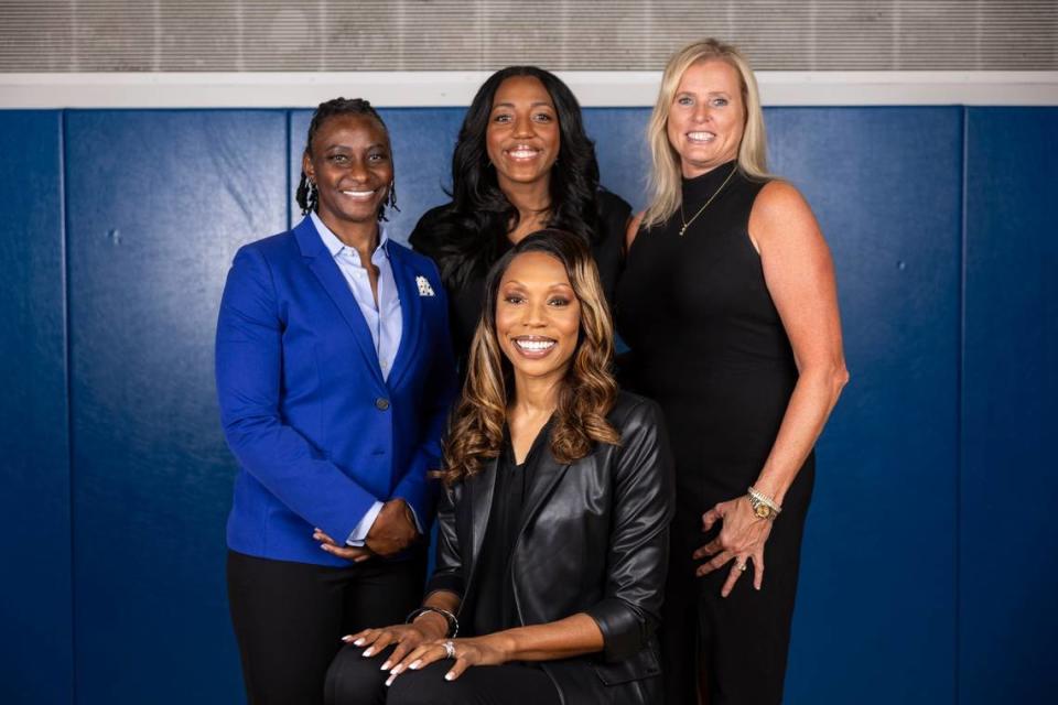 Kyra Elzy, front, posed for a photo before this season with associate head coach Niya Butts, left, and assistants Crystal Kelly, center, and Jen Hoover.