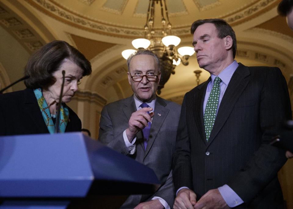 Senate Minority Leader Chuck Schumer of N.Y, center, joined by Sen. Dianne Feinstein, D-Calif., the ranking member of the Senate Judiciary Committee, left, and Sen. Mark Warner, D-Va., vice chair of the Intelligence Committee, right, calls for an investigation into President Donald Trump's administration over its relationship with Russia, including when Trump learned that his national security adviser, Michael Flynn, had discussed U.S. sanctions with a Russian diplomat, Wednesday, Feb. 15, 2016, during a news conference on Capitol Hill in Washington. (AP Photo/J. Scott Applewhite)