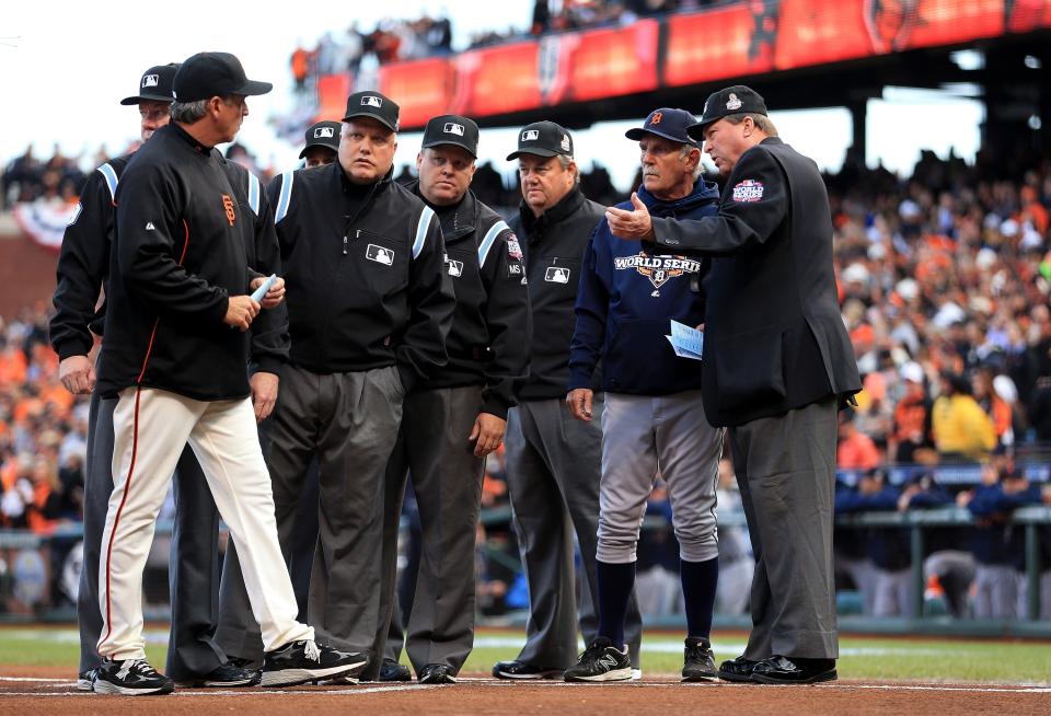 SAN FRANCISCO, CA - OCTOBER 24: Manager Bruce Bochy #15 of the San Francisco Giants and Manager Jim Leyland #10 of the Detroit Tigers go over ground rules with the umpire prior to Game One of the Major League Baseball World Series at AT&T Park on October 24, 2012 in San Francisco, California. (Photo by Doug Pensinger/Getty Images)