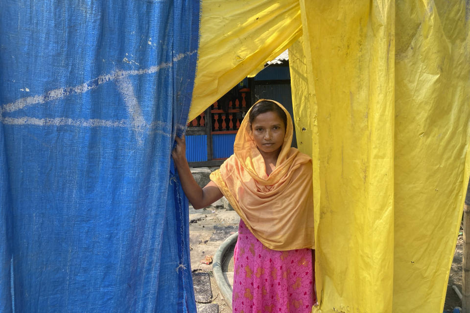 Mili Begum manages a family of four at her Village- Geronkhali, in the Sundarbans, the world’s largest mangrove forest, near the Maitree Super Thermal Power Project in Rampal, Bangladesh, Wednesday, Oct. 19, 2022. A power plant will start burning coal as part of Bangladesh’s plan to meet its energy needs and improve living standards, officials say. (AP Photo/Al-emrun Garjon)