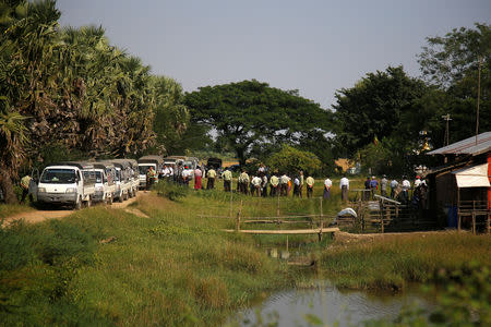 Rohingya Muslims detained by Myanmar immigration authorities are transferred into vehicles after arriving by boat at Thande village outside Yangon, Myanmar November 16, 2018. REUTERS/Myat Thu Kyaw