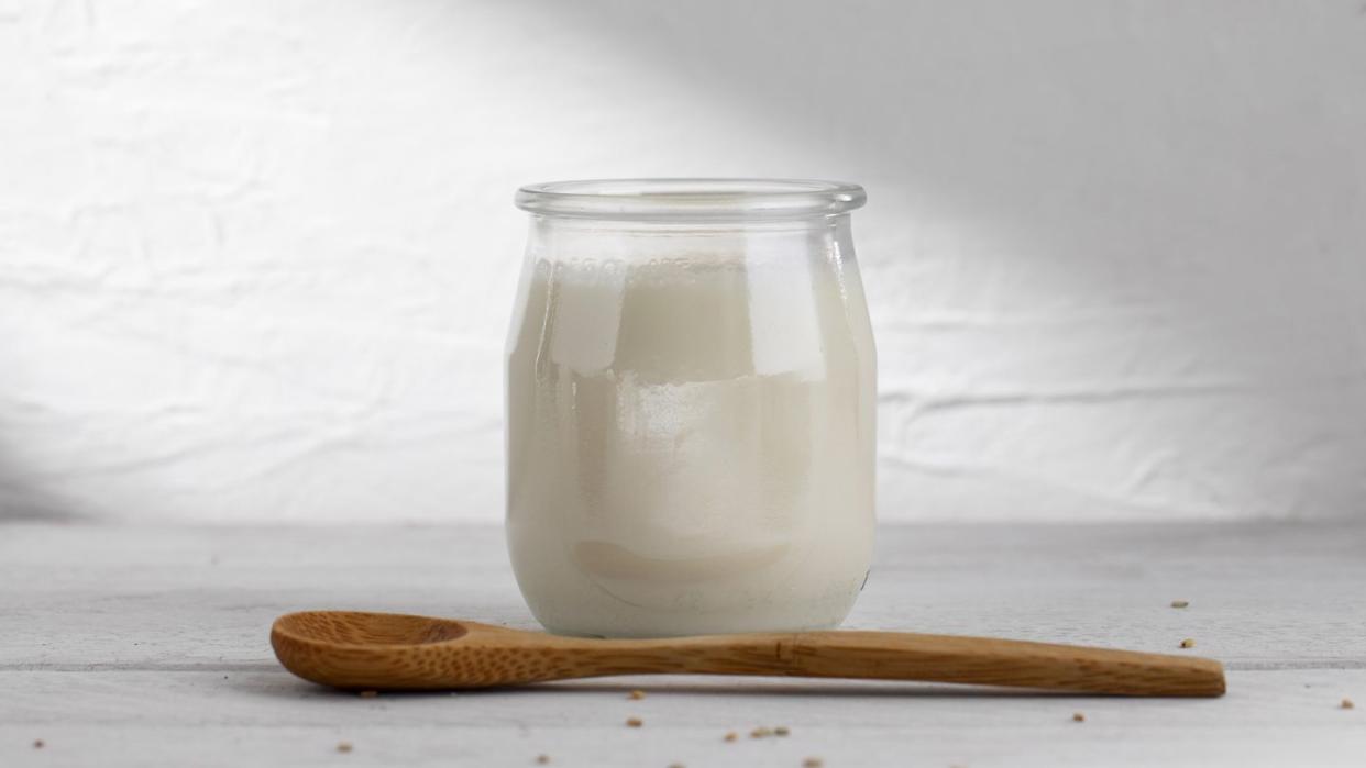 delicious kefir yogurt with wooden spoon