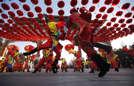 Traditional dancers perform during the opening of the temple fair for the Chinese New Year celebrations at Ditan Park, also known as the Temple of Earth, in Beijing January 30, 2014. REUTERS/Kim Kyung-Hoon