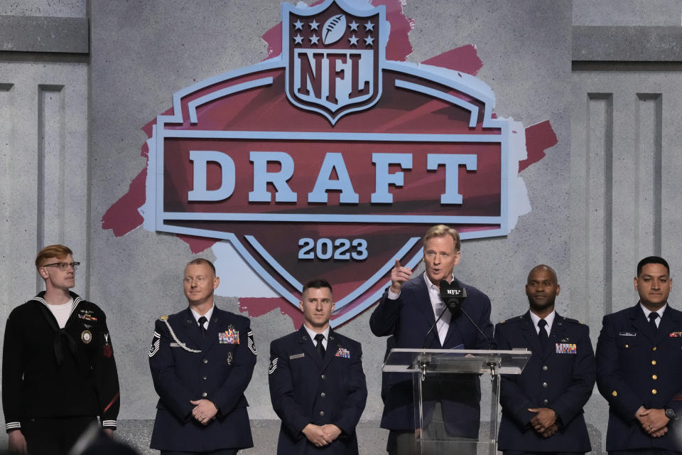 NFL Commissioner Roger Goodell speaks with active duty service members during the second round of the NFL football draft, Friday, April 28, 2023, in Kansas City, Mo. (AP Photo/Charlie Riedel)