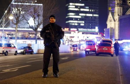 Police stand near the Christmas market in Berlin, Germany December 19, 2016. REUTERS/Pawel Kopczynski