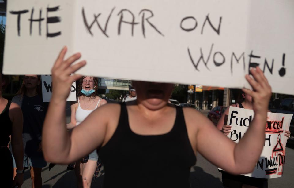 "My Body, My Choice!" yells Hannah Gintner as another woman holds a sign that says Stop the war on Women as she and others take to the downtown streets of Louisville on the Fourth of July to protest the Supreme Court's June 24, 2022 decision that overruled Roe (of the landmark case Roe v. Wade) in the case of Dobbs v. Jackson Women's Health Organization. July 4, 2022