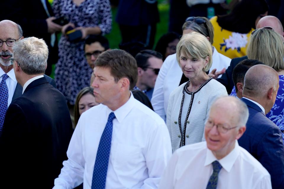 Columbus State Community College President David Harrison, center, and Ohio State President Kristina Johnson, center right, look on before President Joe Biden arrives to sign into law H.R. 4346, the CHIPS and Science Act of 2022, at the White House on Tuesday.