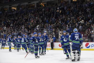 Vancouver Canucks goalie Thatcher Demko (35) and his teammates celebrate after defeating the St. Louis Blues 3-1 during an NHL hockey game in Vancouver, British Columbia, Monday, Jan. 27, 2020. (Darryl Dyck/The Canadian Press via AP)