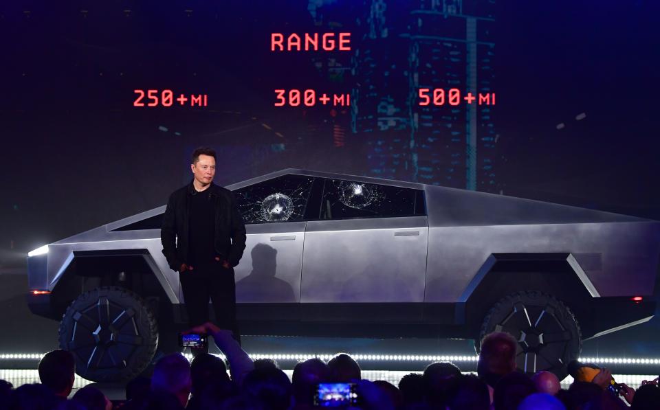 Tesla co-founder and CEO Elon Musk stands in front of the newly unveiled all-electric battery-powered Tesla's Cybertruck at Tesla Design Center in Hawthorne, California on November 21, 2019. (Photo by FREDERIC J. BROWN / AFP) (Photo by FREDERIC J. BROWN/AFP via Getty Images)