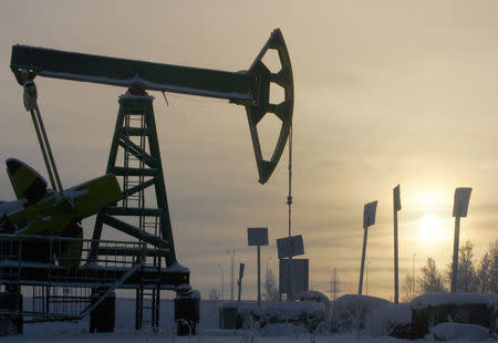 FILE PHOTO: A Yukos oil well is seen at sunset near the Russian northern city of Nefteyugansk, December 19, 2004 in this file photo. REUTERS/Sergei Karpukhin/File Photo