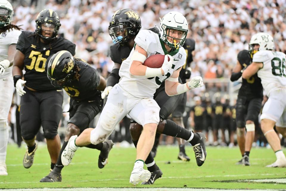 Dawson Pendergrass (35) of the Baylor Bears runs in a 6-yard touchdown in the fourth quarter against the UCF Knights.