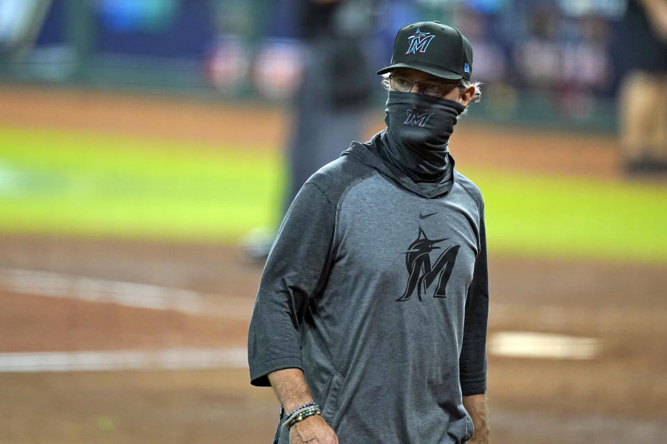 Miami Marlins manager Don Mattingly walks back to the dugout after a pitching change in the fifth inning in Game 3 of a baseball National League Division Series against the Atlanta Braves, Thursday, Oct. 8, 2020, in Houston. (AP Photo/David J. Phillip)