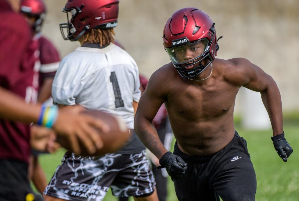 Running back Maliek Ross, heir apparent to Peoria High's standout Malachi Washington, moves into position during a drill on the official first day of high school football practice Monday, Aug. 7, 2023 at Peoria High School.