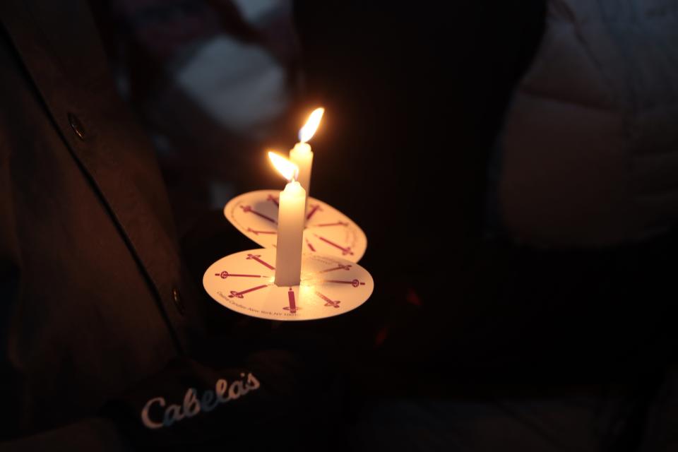 Candles are pictured during a vigil for missing Dee Warner on Saturday at her brother Gregg Hardy's farm in Tipton.