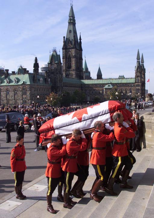RCMP pallbearers carry the casket of former prime minister Pierre Elliott Trudeau up the stairs of the Parliament Buildings in Ottawa, Saturday, Sept. 30, 2000.  Trudeau will lie in state until Monday when he will be moved to Montreal, for  a state funeral Tuesday. (CP PHOTO/Adrian Wyld)