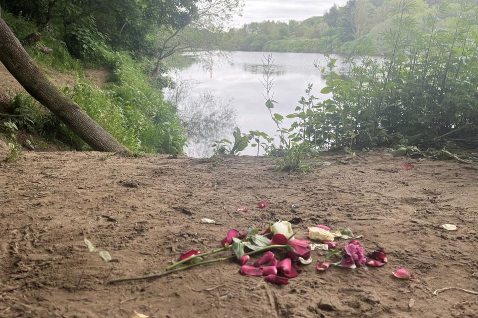 Flowers are left on the bank of the River Tyne at Ovingham, Northumberland (Tom Wilkinson/PA) (PA Wire)