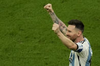 Argentina's Lionel Messi celebrates after scoring his side's opening goal during the World Cup final soccer match between Argentina and France at the Lusail Stadium in Lusail, Qatar, Sunday, Dec. 18, 2022. (AP Photo/Francisco Seco)
