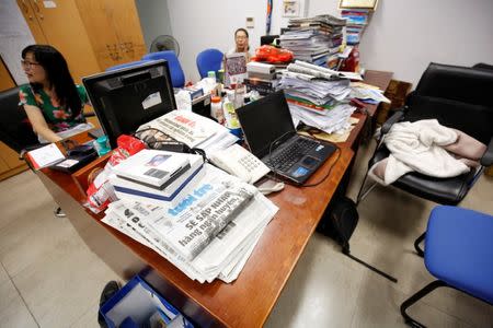 Journalists talk at the Tuoi Tre newspaper's office in Hanoi, Vietnam July 17, 2018. REUTERS/Kham