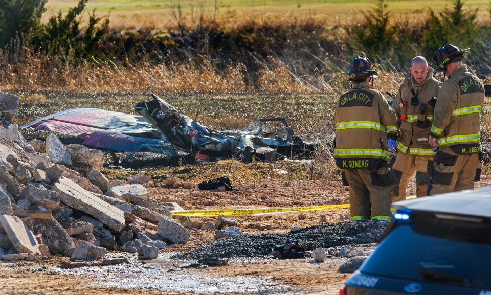 The Oklahoma City Fire Department works the scene of a plane crash in northwest Oklahoma City on Sunday.