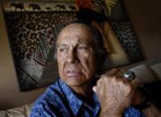 American Indian activist Russell Means poses for a portrait at his home in Scottsdale, Arizona, October 28, 2011. Means is used to battles, having faced off against the U.S. government early and often throughout his high-profile life. Now the controversial former leader of the American Indian Movement is engaged in a different fight -- against advanced esophageal cancer. To match story PEOPLE-MEANS/ REUTERS/Joshua Lott (UNITED STATES - Tags: SOCIETY POLITICS HEALTH)