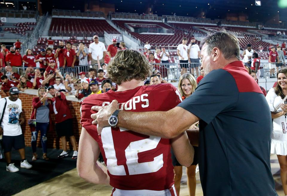 Oklahoma's Drake Stoops (12) greets his dad Bob Stoops after the college football game between the University of Oklahoma and the Kent State Golden Flashes at the Gaylord Family Oklahoma Memorial Stadium in Norman, Okla., Saturday, Sept., 10, 2022. 