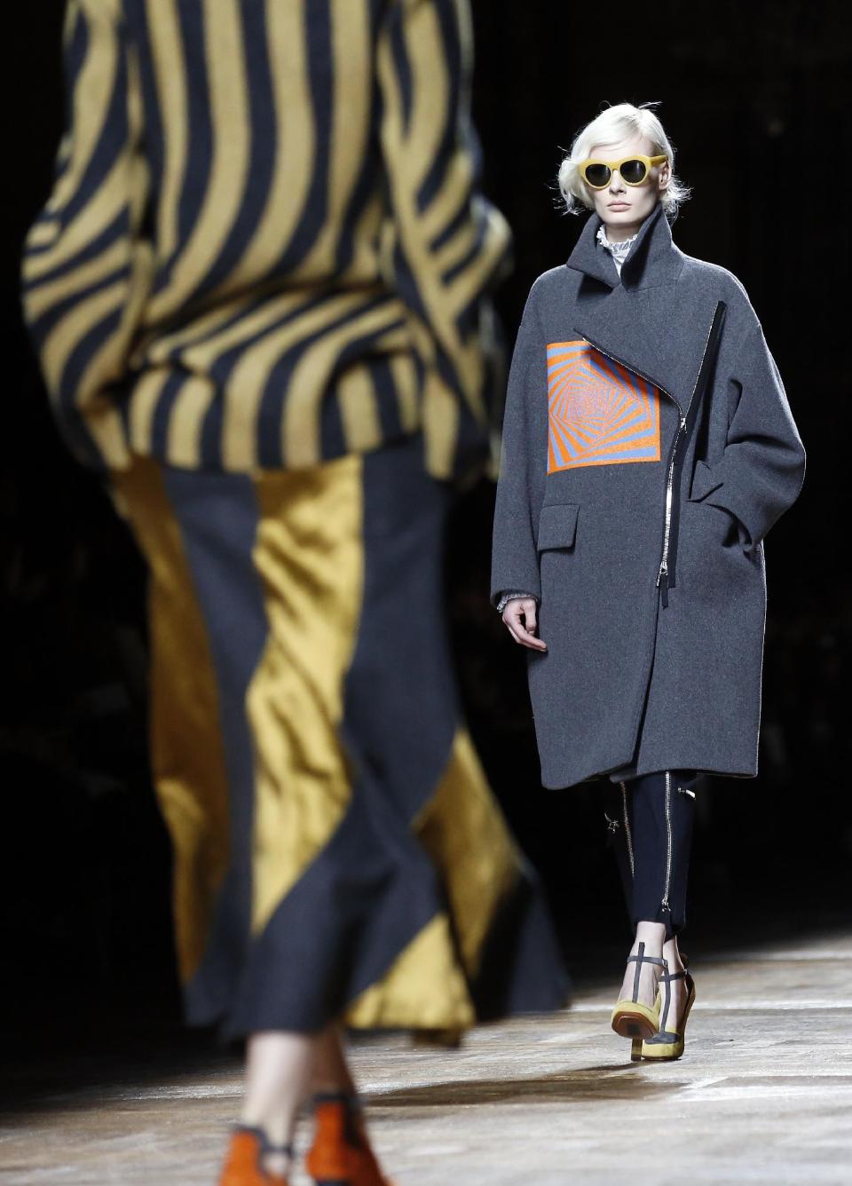 A model wears a creation for Dries van Noten's ready-to-wear fall/winter 2014-2015 fashion collection presented in Paris, Wednesday, Feb.26, 2014. (AP Photo/Jerome Delay)