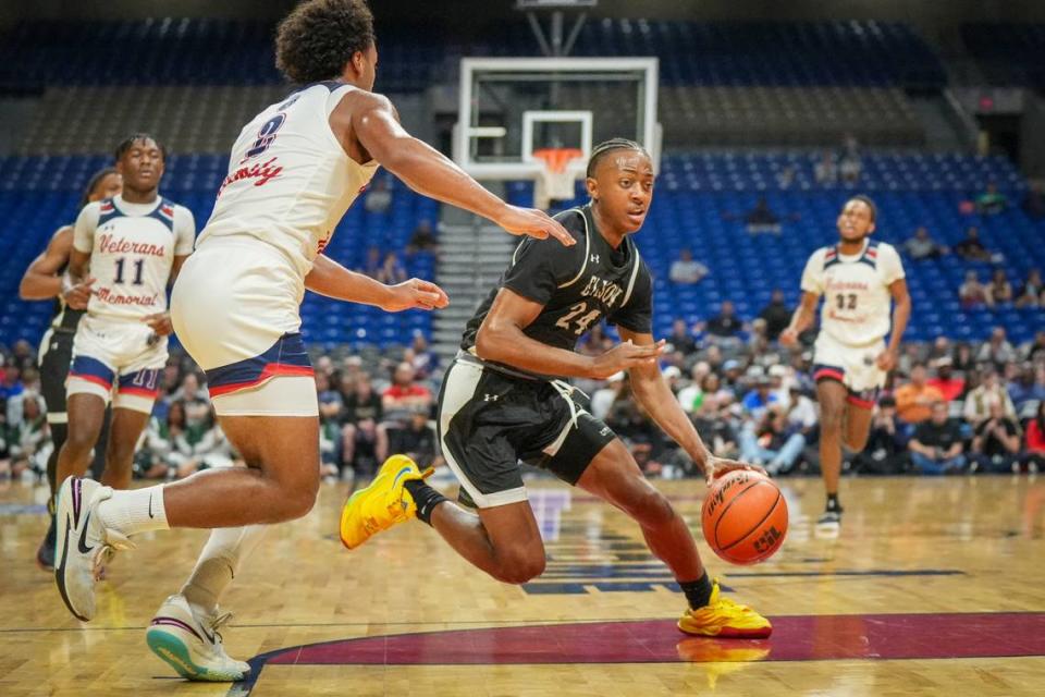 Killeen Ellison guard Ahziel McIver (24) tries to get around Devin McCloud (2) of San Antonio Veterans Memorial in a Class 5A state semifinal on Thursday, March 7, 2024 at the Alamodome in San Antonio, Texas. McIver scored a game-high 23 points as Ellison defeated Veteran’s Memorial 59-47. University Interscholastic League