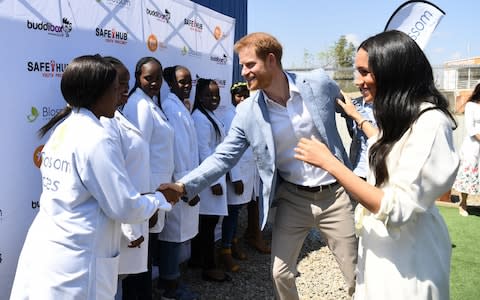 Harry and Meghan visit Tembisa township to learn about Youth Employment Services  - Credit: Getty