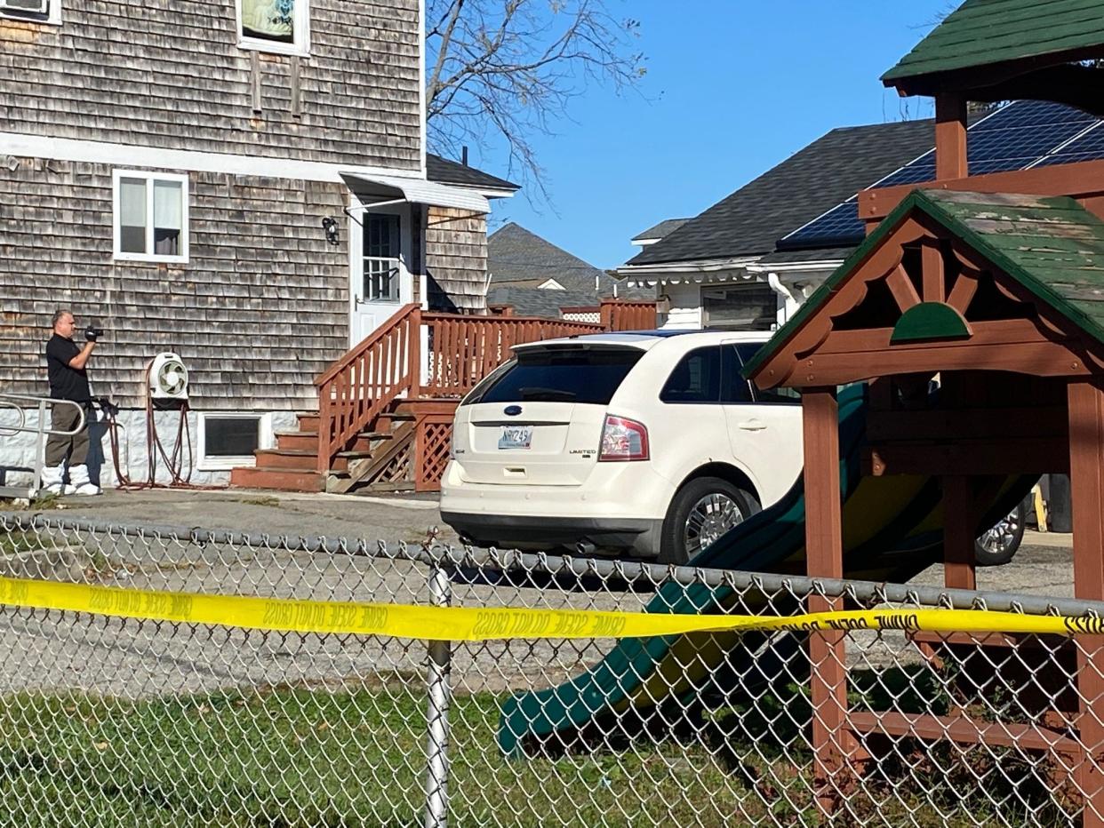 Cranston police investigators work outside a house where police officers and firefighters encountered a 4-year-old boy with an apparent gunshot wound to the head on Tuesday morning.