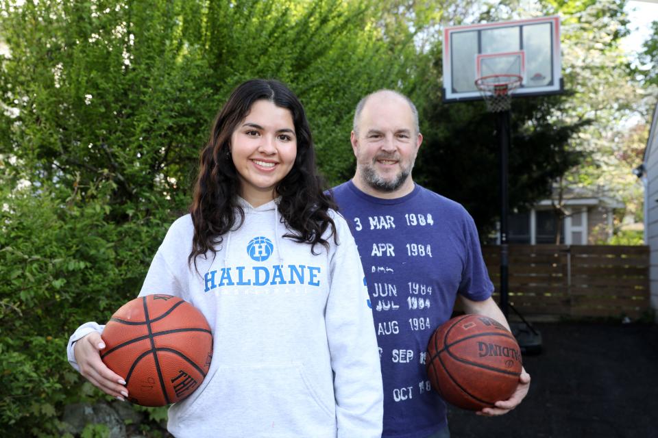 Camilla McDaniel, a Haldane senior, has long honed her 3-point shooting, in part through competition with her former CYO coach, her dad Jeffrey. They are photographed at home in Cold Spring April 29, 2024.