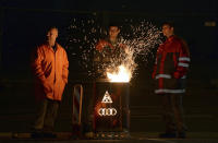 <p>Audi employees warm up around a fire in a barrel during a rally at the factory of the automaker in Ingolstadt, Germany, April 29, 2016. Workers in the metal and electrical industry have begun nationwide strikes at night on April 29. In several workplaces, employees will temporarily stop working during the day, according to German metalworkers’ union IG Metall. Strikers demanded for a pay increase of five percent for 3.8 million employees in the sector.<i> (Andreas Gebert/EPA)</i></p>