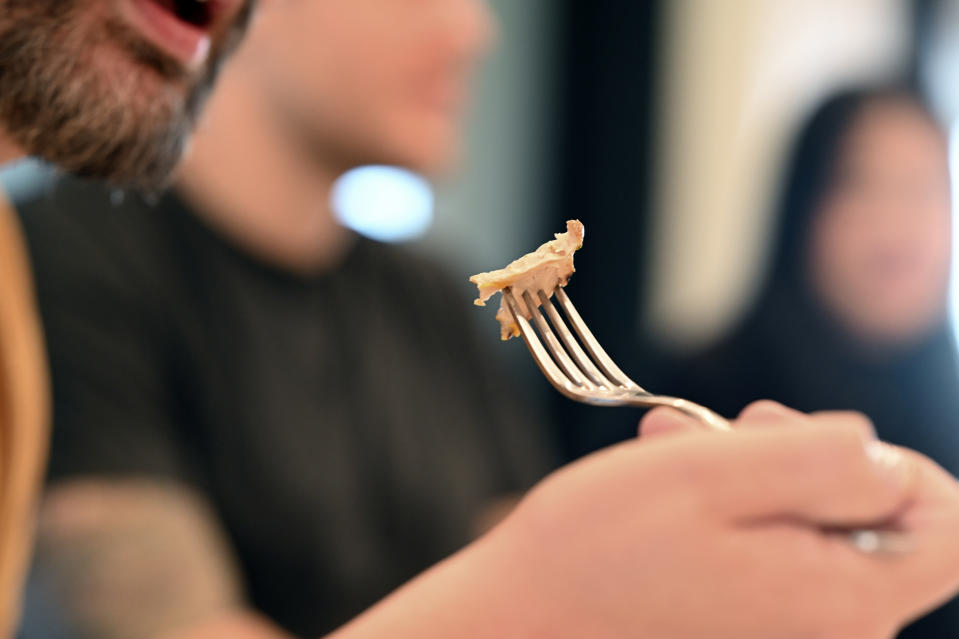 Ryen Anderson tastes cultivate chicken before sampling it at GOOD Meat's Alameda, Calif., headquarters on Thursday, Sept. 28, 2023. The company's cultivated chicken, which is grown from animal cells, is approved for sale in the United States and Singapore. (AP Photo/Noah Berger)