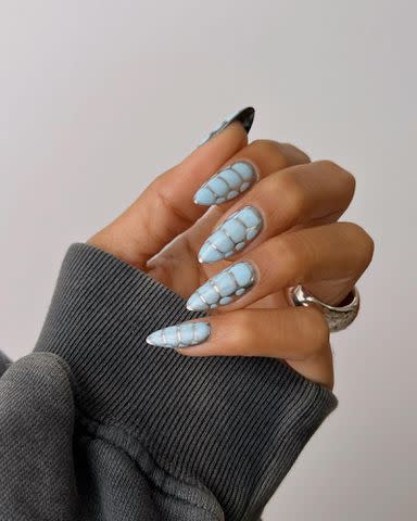<p>Melanie Graves Instagram</p> Textured nail design by @overglowedit.