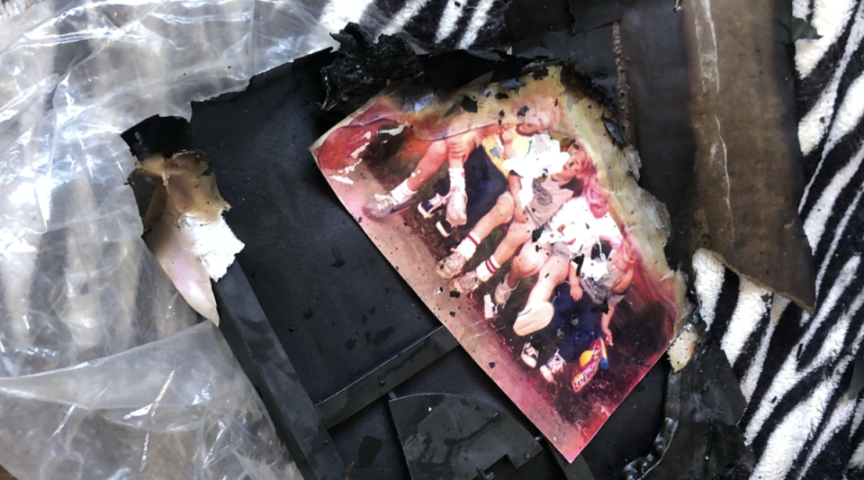 Charred photographs at the Los Angeles home of Lynne Mishele after Friday’s crash (GoFundme)